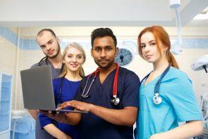 it-support-young-doctors-working-on-laptop